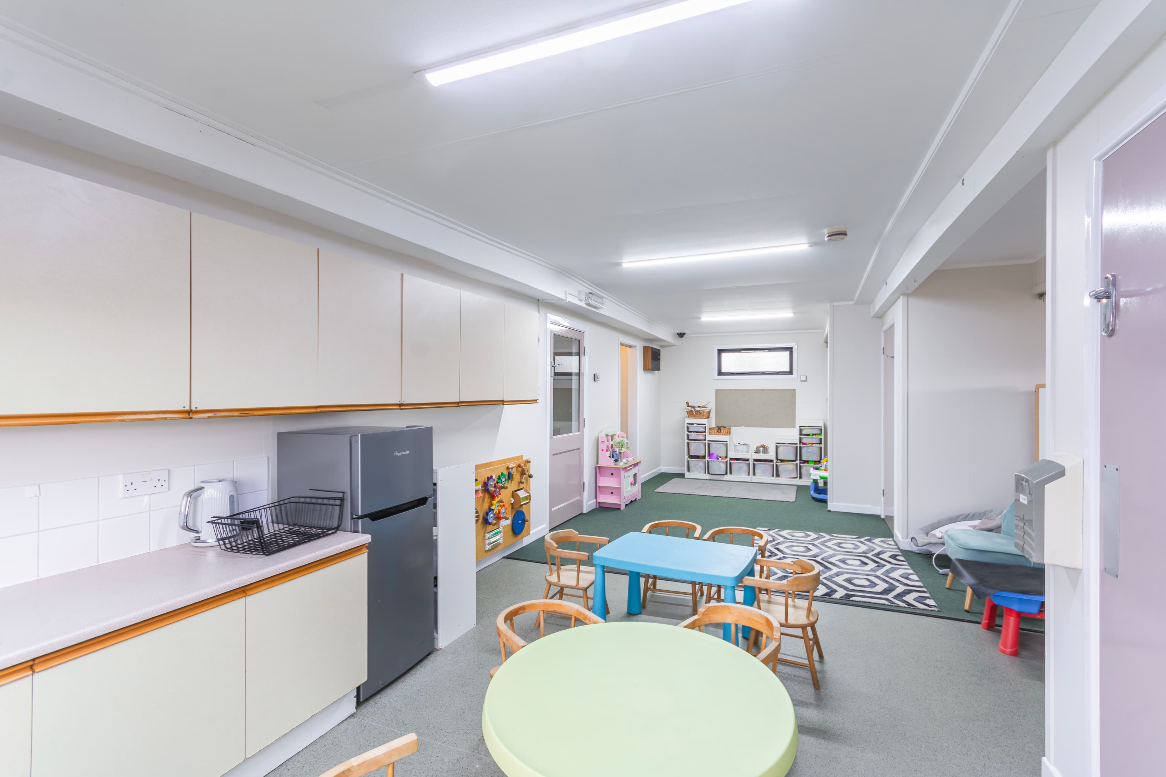 Baby Room with kitchen area and activity tables
