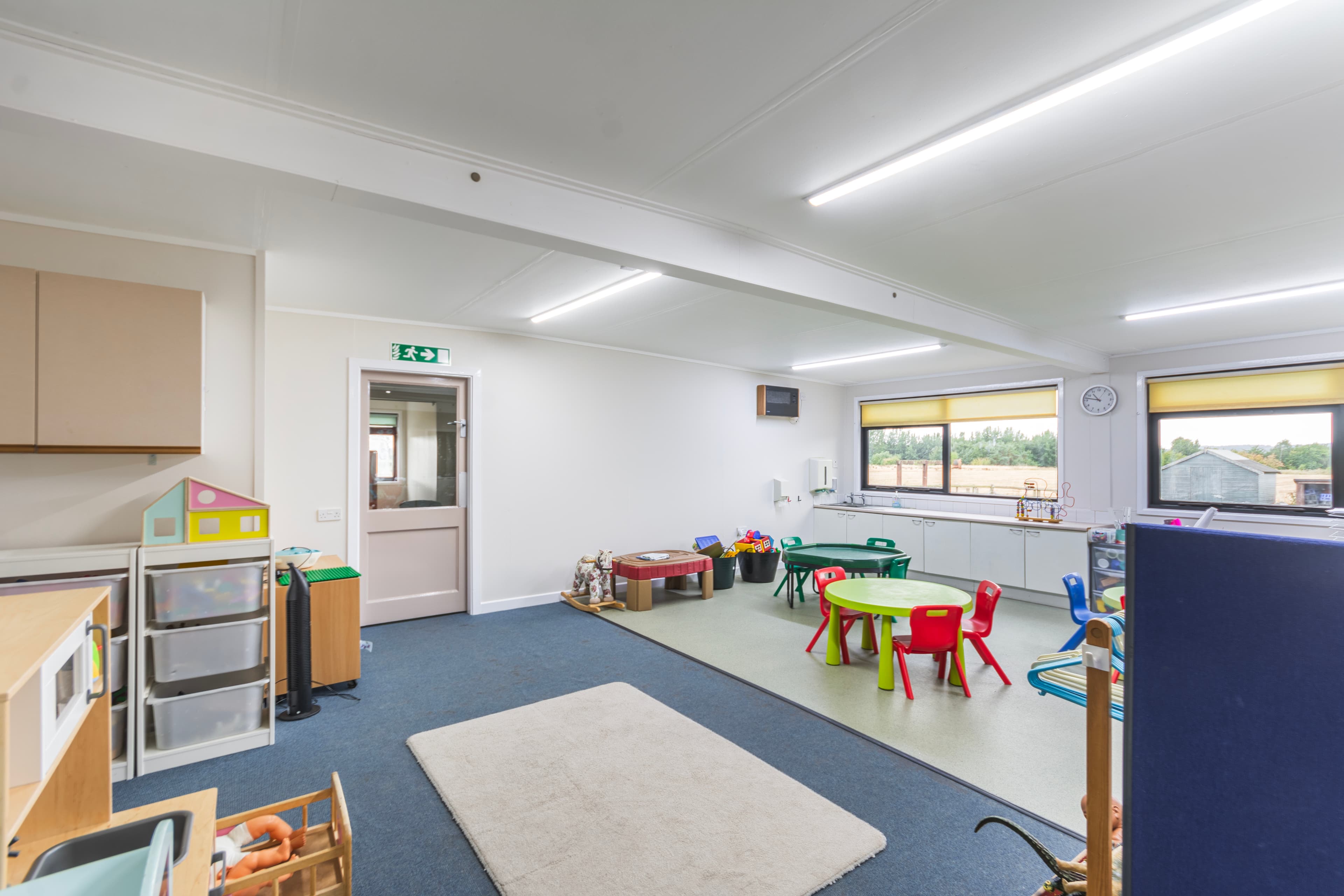 Toddler Room with play areas and countryside views through windows